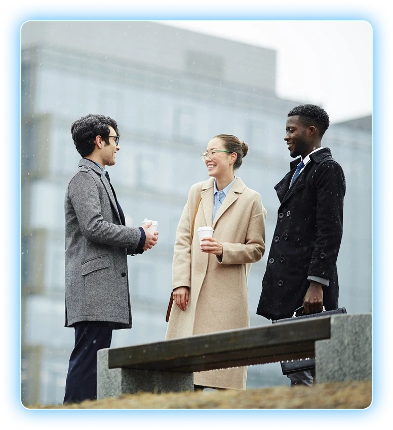 Healthcare marketing team meeting outdoors over coffee