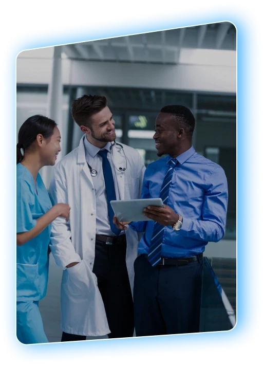 Hospital staff reviewing notes on a tablet together